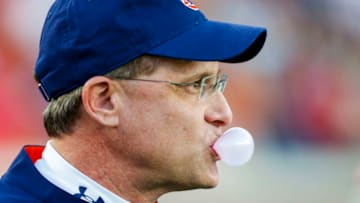 OXFORD, MS - OCTOBER 29: Auburn Tigers head coach Gus Malzahn blows a bubble as he watches team warm up before an NCAA college football game against the Mississippi Rebels on October 29, 2016 in Oxford, Mississippi. (Photo by Butch Dill/Getty Images)