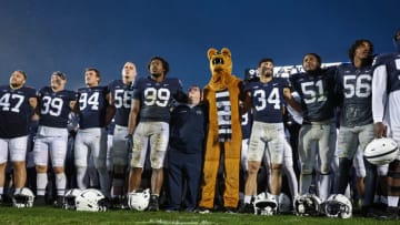 STATE COLLEGE, PA - OCTOBER 01: The Penn State Nittany Lion mascot stands with players on the field after the game at Beaver Stadium on October 1, 2022 in State College, Pennsylvania. (Photo by Scott Taetsch/Getty Images)