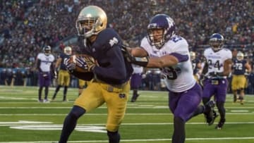 Nov 15, 2014; South Bend, IN, USA; Notre Dame Fighting Irish wide receiver William Fuller (7) catches a pass for a touchdown as Northwestern Wildcats cornerback Nick VanHoose (23) defends in the second quarter at Notre Dame Stadium. Mandatory Credit: Matt Cashore-USA TODAY Sports