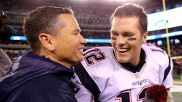 EAST RUTHERFORD, NJ - NOVEMBER 27: Tom Brady #12 of the New England Patriots celebrates with trainer Alex Guerrero after defeating the New York Jets with a score of 22 to 17 at MetLife Stadium on November 27, 2016 in East Rutherford, New Jersey. (Photo by Elsa/Getty Images)