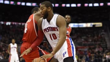 Jan 19, 2015; Atlanta, GA, USA; Detroit Pistons forward Greg Monroe (10) dribbles the ball around Atlanta Hawks forward Paul Millsap (4) during the first half at Philips Arena. Mandatory Credit: Dale Zanine-USA TODAY Sports