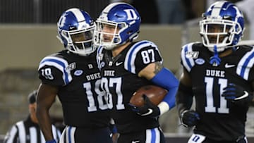 BLACKSBURG, VA - SEPTEMBER 27: Tight end Noah Gray #87 of the Duke Blue Devils celebrates his touchdown reception against the Virginia Tech Hokies with quarterback Quentin Harris #18 in the first half at Lane Stadium on September 27, 2019 in Blacksburg, Virginia. (Photo by Michael Shroyer/Getty Images)
