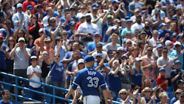 TORONTO, ON - JUNE 20: J.A. Happ #33 of the Toronto Blue Jays receives an ovation from the crowd as he exits the game after being relieved in the ninth inning against the Atlanta Braves at Rogers Centre on June 20, 2018 in Toronto, Canada. (Photo by Tom Szczerbowski/Getty Images)