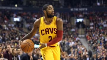 Dec 5, 2014; Toronto, Ontario, CAN; Cleveland Cavaliers point guard Kyrie Irving (2) with the ball against the Toronto Raptors at Air Canada Centre. The Cavaliers beat the Raptors 105-91. Mandatory Credit: Tom Szczerbowski-USA TODAY Sports