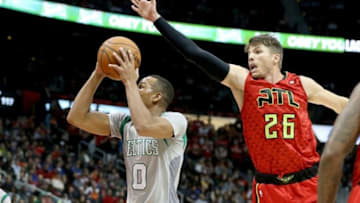 Nov 24, 2015; Atlanta, GA, USA; Boston Celtics guard Avery Bradley (0) attempts a shot against Atlanta Hawks guard Kyle Korver (26) in the third quarter of their game at Philips Arena. Mandatory Credit: Jason Getz-USA TODAY Sports