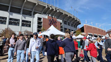 Auburn footballNov 25, 2023; Auburn, Alabama, USA; Auburn Tiger and Alabama Crimson Tide fans gather outside Jordan-Hare Stadium before the game between Auburn and Alabama. Mandatory Credit: John Reed-USA TODAY Sports