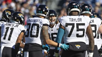 NASHVILLE, TENNESSEE - DECEMBER 12: Trevor Lawrence #16 of the Jacksonville Jaguars calls the play in the huddle during a game against the Tennessee Titans at Nissan Stadium on December 12, 2021 in Nashville, Tennessee. The Titans defeated the Jaguars 20-0. (Photo by Wesley Hitt/Getty Images)