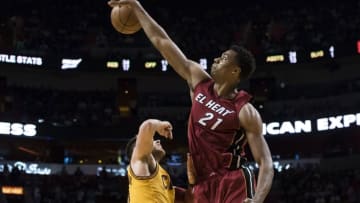 Mar 19, 2016; Miami, FL, USA; Miami Heat center Hassan Whiteside (21) blocks the shot from Cleveland Cavaliers guard Matthew Dellavedova (8) during the second half at American Airlines Arena. The Heat won 122-101. Mandatory Credit: Steve Mitchell-USA TODAY Sports