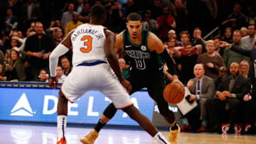 NEW YORK, NY - OCTOBER 20: Jayson Tatum #0 of the Boston Celtics dribble sthe ball against Tim Hardaway Jr. #3 of the New York Knicksat Madison Square Garden on October 20, 2018 in New York City. (Photo by Mike Stobe/Getty Images)