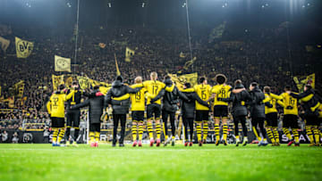 DORTMUND, GERMANY - JANUARY 24: (EDITORS NOTE: Image has been digitally enhanced.) Team of Dortmund celebrates his win with the fans after the Bundesliga match between Borussia Dortmund and 1. FC Köln at Signal Iduna Park on January 24, 2020 in Dortmund, Germany. (Photo by Lukas Schulze/Bundesliga/Bundesliga Collection via Getty Images)