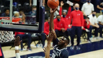 Mar 6, 2021; Storrs, Connecticut, USA; Georgetown Hoyas center Qudus Wahab (34) shoots against Connecticut Huskies forward Isaiah Whaley (5) during the second half at Harry A. Gampel Pavilion. UConn defeated Georgetown 98-82. Mandatory Credit: David Butler II-USA TODAY Sports
