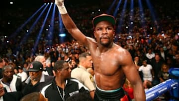 May 3, 2014; Las Vegas, NV, USA; Floyd Mayweather Jr. celebrates after defeating Marcos Maidana (not pictured) during their fight at the MGM Grand. Mandatory Credit: Mark J. Rebilas-USA TODAY Sports