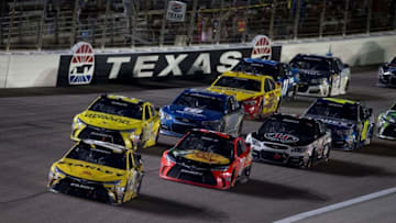 Apr 9, 2016; Fort Worth, TX, USA; Sprint Cup Series driver Carl Edwards (19) and driver Martin Truex Jr. (78) and driver Matt Kenseth (20) lead the rest of the field on a restart during the Duck Commander 500 at Texas Motor Speedway. Mandatory Credit: Jerome Miron-USA TODAY Sports