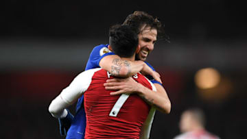 LONDON, ENGLAND - JANUARY 03: Cesc Fabregas of Chelsea and Alexis Sanchez of Arsenal react during the Premier League match between Arsenal and Chelsea at Emirates Stadium on January 3, 2018 in London, England. (Photo by Shaun Botterill/Getty Images)