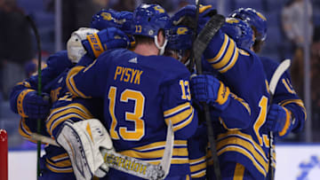 Feb 15, 2022; Buffalo, New York, USA; The Buffalo Sabres celebrate a win over the New York Islanders at KeyBank Center. Mandatory Credit: Timothy T. Ludwig-USA TODAY Sports