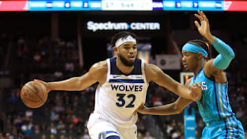 CHARLOTTE, NORTH CAROLINA - OCTOBER 25: Karl-Anthony Towns #32 of the Minnesota Timberwolves drives to the basket against Devonte' Graham #4 of the Charlotte Hornets. (Photo by Streeter Lecka/Getty Images)