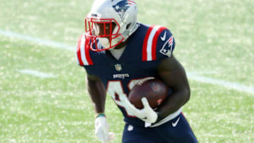 FOXBOROUGH, MASSACHUSETTS - SEPTEMBER 27: J.J. Taylor #42 of the New England Patriots runs with the ball during the second half against the Las Vegas Raiders at Gillette Stadium on September 27, 2020 in Foxborough, Massachusetts. (Photo by Maddie Meyer/Getty Images)