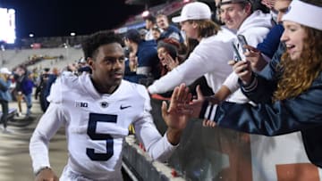 COLLEGE PARK, MARYLAND - NOVEMBER 06: Jahan Dotson #5 of the Penn State Nittany Lions celebrates with fans after a 31-14 victory against the Maryland Terrapins at Capital One Field at Maryland Stadium on November 06, 2021 in College Park, Maryland. (Photo by Greg Fiume/Getty Images)