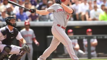 Jul 26, 2015; Denver, CO, USA; Cincinnati Reds right fielder Jay Bruce (32) hits a home run during the third inning against the Colorado Rockies at Coors Field. Mandatory Credit: Chris Humphreys-USA TODAY Sports