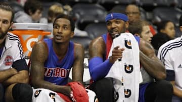 Oct 18, 2014; Atlanta, GA, USA; Detroit Pistons guard Brandon Jennings (7) and forward Josh Smith (6) watch from the bench against the Atlanta Hawks in the first quarter at Philips Arena. Mandatory Credit: Brett Davis-USA TODAY Sports