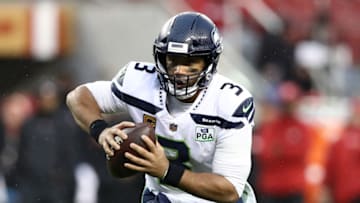 SANTA CLARA, CA - DECEMBER 16: Russell Wilson #3 of the Seattle Seahawks scrambles with the ball against the San Francisco 49ers during their NFL game at Levi's Stadium on December 16, 2018 in Santa Clara, California. (Photo by Ezra Shaw/Getty Images)