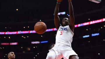 LOS ANGELES, CA - JANUARY 15: Montrezl Harrell #5 of the LA Clippers reacts as he dunks the ball in front of Chris Paul #3 of the Houston Rockets during a 113-102 Clipper win at Staples Center on January 15, 2018 in Los Angeles, California. (Photo by Harry How/Getty Images)