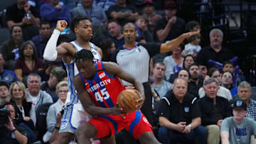 Detroit Pistons forward Sekou Doumbouya (45) drives in against Sacramento Kings guard Buddy Hield Credit: Kelley L Cox-USA TODAY Sports