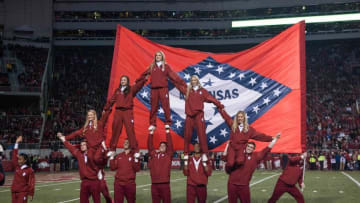 Nov 12, 2016; Fayetteville, AR, USA; Arkansas Razorbacks spirit squad member display an Arkansas state flag in between quarters of the game against the LSU Tigers at Donald W. Reynolds Razorback Stadium. LSU won 38-10. Mandatory Credit: Brett Rojo-USA TODAY Sports
