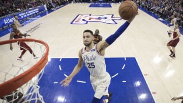 PHILADELPHIA, PA - APRIL 6: Ben Simmons #25 of the Philadelphia 76ers dunks the ball past LeBron James #23 of the Cleveland Cavaliers in the second quarter at the Wells Fargo Center on April 6, 2018 in Philadelphia, Pennsylvania. The 76ers defeated the Cavaliers 132-130. (Photo by Mitchell Leff/Getty Images)