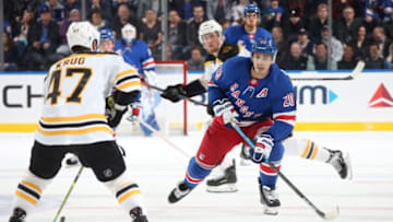 NEW YORK, NY - OCTOBER 27: Chris Kreider #20 of the New York Rangers defends against Torey krug #47 of the Boston Bruins