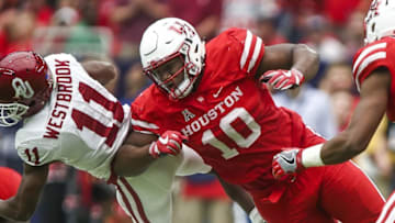 Sep 3, 2016; Houston, TX, USA; Houston Cougars defensive tackle Ed Oliver (10) attempts to make a tackle on Oklahoma Sooners wide receiver Dede Westbrook (11) during the game at NRG Stadium. Mandatory Credit: Troy Taormina-USA TODAY Sports