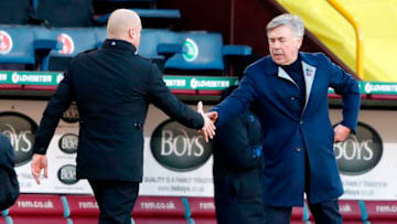 Burnley's English manager Sean Dyche (L) shakes hands with Everton's Italian head coach Carlo Ancelotti after the English Premier League football match between Burnley and Everton at Turf Moor in Burnley, north west England on December 5, 2020. (Photo by Clive Brunskill / POOL / AFP) / RESTRICTED TO EDITORIAL USE. No use with unauthorized audio, video, data, fixture lists, club/league logos or 'live' services. Online in-match use limited to 120 images. An additional 40 images may be used in extra time. No video emulation. Social media in-match use limited to 120 images. An additional 40 images may be used in extra time. No use in betting publications, games or single club/league/player publications. / (Photo by CLIVE BRUNSKILL/POOL/AFP via Getty Images)