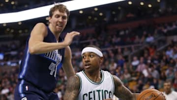 Nov 18, 2015; Boston, MA, USA; Boston Celtics guard Isaiah Thomas (4) drives the ball against Dallas Mavericks forward Dirk Nowitzki (41) in the second half at TD Garden. Dallas defeated the Celtics 106-102. Mandatory Credit: David Butler II-USA TODAY Sports