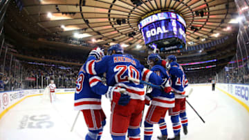 NEW YORK, NY - DECEMBER 27: Mika Zibanejad #93, Chris Kreider #20 and members of the New York Rangers celebrate after a goal in the first period against the Carolina Hurricanes at Madison Square Garden on December 27, 2019 in New York City. (Photo by Jared Silber/NHLI via Getty Images)