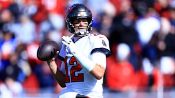 TAMPA, FLORIDA - JANUARY 23: Tom Brady #12 of the Tampa Bay Buccaneers warms up prior to playing the Los Angeles Rams in the NFC Divisional Playoff game at Raymond James Stadium on January 23, 2022 in Tampa, Florida. (Photo by Mike Ehrmann/Getty Images)