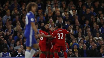 Chelsea's Brazilian defender David Luiz (L) reacts as Liverpool's Croatian defender Dejan Lovren (3L) celebrates scoring his team's first goal during the English Premier League football match between Chelsea and Liverpool at Stamford Bridge in London on September 16, 2016. / AFP / Adrian DENNIS / RESTRICTED TO EDITORIAL USE. No use with unauthorized audio, video, data, fixture lists, club/league logos or 'live' services. Online in-match use limited to 75 images, no video emulation. No use in betting, games or single club/league/player publications. / (Photo credit should read ADRIAN DENNIS/AFP/Getty Images)