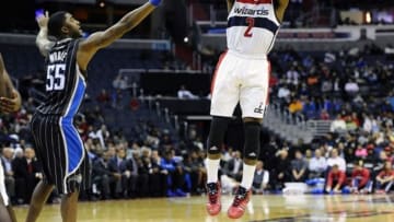 Dec 2, 2013; Washington, DC, USA; Washington Wizards point guard John Wall (2) attempts a jump shot over Orlando Magic point guard E