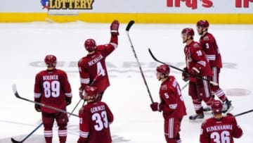 Apr 13, 2014; Glendale, AZ, USA; Phoenix Coyotes defenseman Zbynek Michalek (4) waves to fans as the team leaves the ice after beating the Dallas Stars 2-1 at Jobing.com Arena. Mandatory Credit: Matt Kartozian-USA TODAY Sports