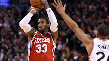Apr 12, 2016; Toronto, Ontario, CAN; Philadelphia 76ers forward Robert Covington (33) makes a three point shot past the outstretched hand of Toronto Raptors guard Norman Powell (24) in the first half at Air Canada Centre. Mandatory Credit: Dan Hamilton-USA TODAY Sports