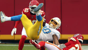 KANSAS CITY, MISSOURI - JANUARY 03: Austin Ekeler #30 of the Los Angeles Chargers is upended by BoPete Keyes #29 of the Kansas City Chiefs during the 1st half of the game at Arrowhead Stadium on January 03, 2021 in Kansas City, Missouri. (Photo by Jamie Squire/Getty Images)