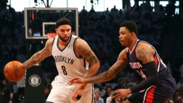 Apr 27, 2015; Brooklyn, NY, USA; Brooklyn Nets guard Deron Williams (8) drives around Atlanta Hawks guard Kent Bazemore (24) during the first quarter in game four of the first round of the NBA Playoffs. at Barclays Center. Mandatory Credit: Anthony Gruppuso-USA TODAY Sports
