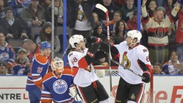 Nov 13, 2014; Edmonton, Alberta, CAN; Ottawa Senators left wing Mike Hoffman (68) and right wing Bobby Ryan (6) celebrate after scoring a goal against Edmonton Oilers goalie Ben Scrivens (30) at Rexall Place. Mandatory Credit: Steve Alkok-USA TODAY Sports