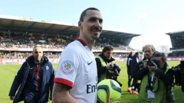 TROYES, FRANCE - MARCH 13: Zlatan Ibrahimovic of PSG keeps the ball of the match because he scored 4 goals while celebrating winning the French League 1 championships 2015-1016 following the French Ligue 1 match between ESTAC Troyes and Paris Saint-Germain (PSG) at Stade de l'Aube on March 13, 2016 in Troyes, France. (Photo by Jean Catuffe/Getty Images)