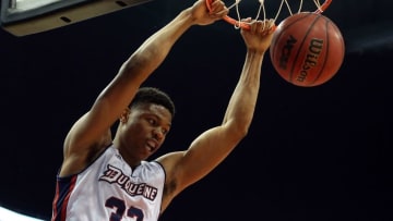 Feb 21, 2015; Pittsburgh, PA, USA; Duquesne Dukes forward L.G. Gill (33) dunks the ball against the Dayton Flyers during the second half at the CONSOL Energy Center. Duquesne won 83-73. Mandatory Credit: Charles LeClaire-USA TODAY Sports