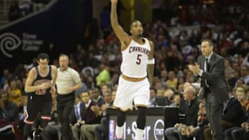 Jan 19, 2015; Cleveland, OH, USA; Cleveland Cavaliers guard J.R. Smith (5) celebrates a three-point basket in the first quarter against the Chicago Bulls at Quicken Loans Arena. Mandatory Credit: David Richard-USA TODAY Sports