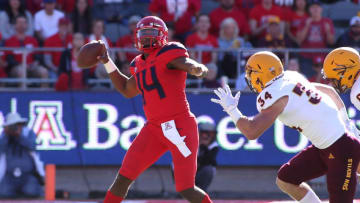 TUCSON, AZ - NOVEMBER 24: Quarterback Khalil Tate #14 of the Arizona Wildcats looks to pass as he is pressured by linebacker Kyle Soelle #34 of the Arizona State Sun Devils during the first half of the college fottball game at Arizona Stadium on November 24, 2018 in Tucson, Arizona. (Photo by Ralph Freso/Getty Images)