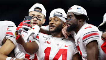 INDIANAPOLIS, IN - DECEMBER 07: Austin Mack #11, K.J. Hill #14 and Binjimen Victor #9 of the Ohio State Buckeyes celebrate after the win against the Wisconsin Badgers in the Big Ten Football Championship at Lucas Oil Stadium on December 7, 2019 in Indianapolis, Indiana. Ohio State defeated Wisconsin 34-21. (Photo by Joe Robbins/Getty Images)