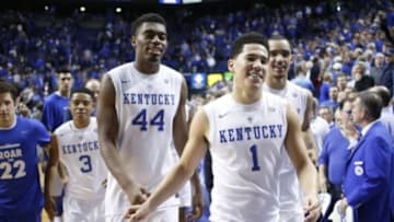 Dec 13, 2014; Lexington, KY, USA; Kentucky Wildcats guard Devin Booker (1) center Dakari Johnson (44) and forward Trey Lyles (41) celebrate after the game against the North Carolina Tar Heels at Rupp Arena. The Kentucky Wildcats defeated North Carolina Tar Heels 84-70. Mandatory Credit: Mark Zerof-USA TODAY Sports