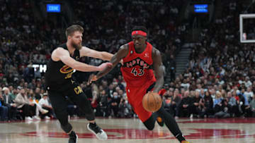 Oct 19, 2022; Toronto, Ontario, CAN; Toronto Raptors forward Pascal Siakam (43) controls the ball as Cleveland Cavaliers forward Dean Wade (32) tries to defend during the third quarter at Scotiabank Arena. Mandatory Credit: Nick Turchiaro-USA TODAY Sports