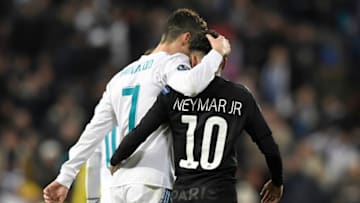 TOPSHOT - Real Madrid's Portuguese forward Cristiano Ronaldo (L) and Paris Saint-Germain's Brazilian forward Neymar leave the pitch at half-time during the UEFA Champions League round of sixteen first leg football match Real Madrid CF against Paris Saint-Germain (PSG) at the Santiago Bernabeu stadium in Madrid on February 14, 2018. (Photo by GABRIEL BOUYS / AFP) (Photo credit should read GABRIEL BOUYS/AFP via Getty Images)